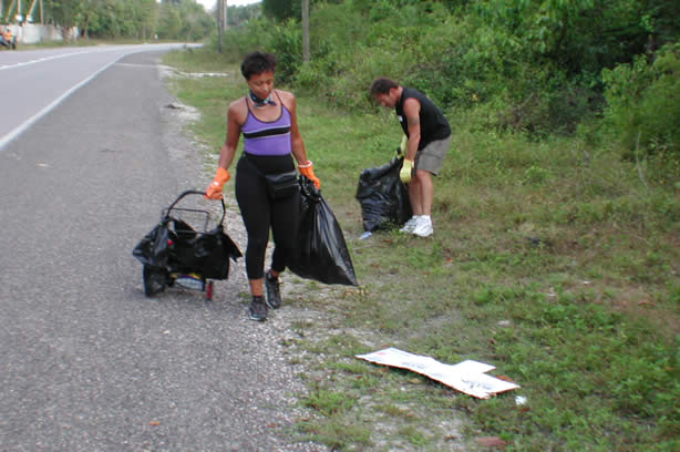 Volunteers Clean-Up Roadside Entrance to Negril - Negril Travel Guide